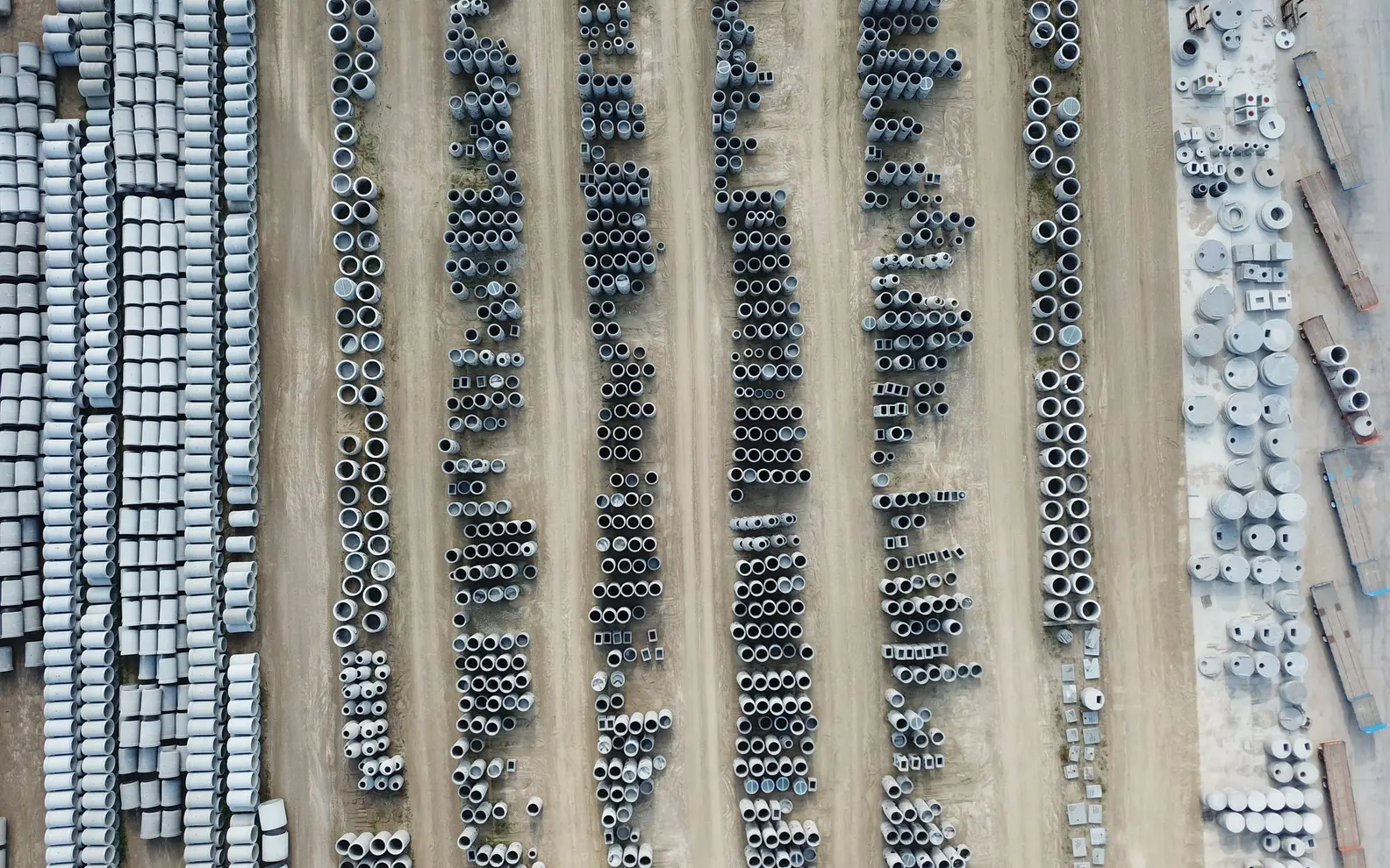 Aerial view of organised precast concrete products in an outdoor manufacturing yard