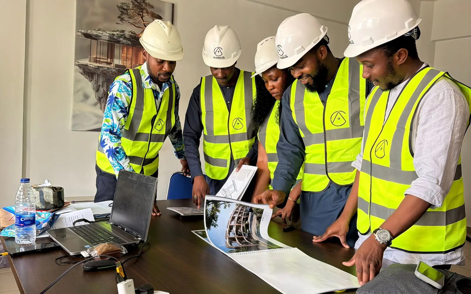 Structural engineering team reviewing building information and technical documents together